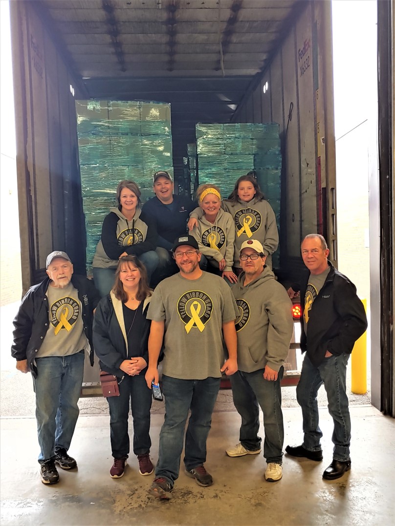 photo of shipthrifty and send santa to the troops team with care packages in truck